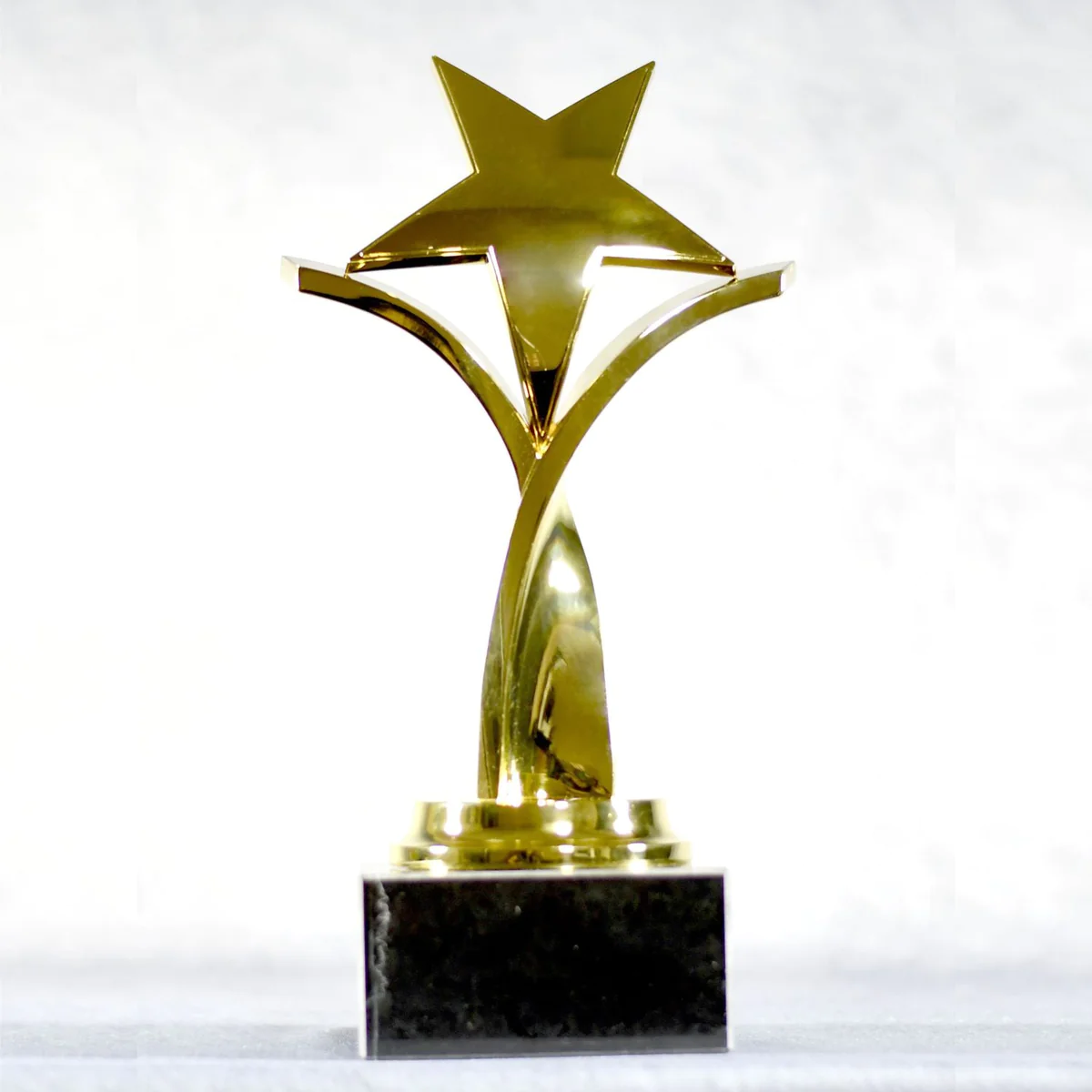 Twisting Star On Black Marble Base, Gold, Silver, Bronze 